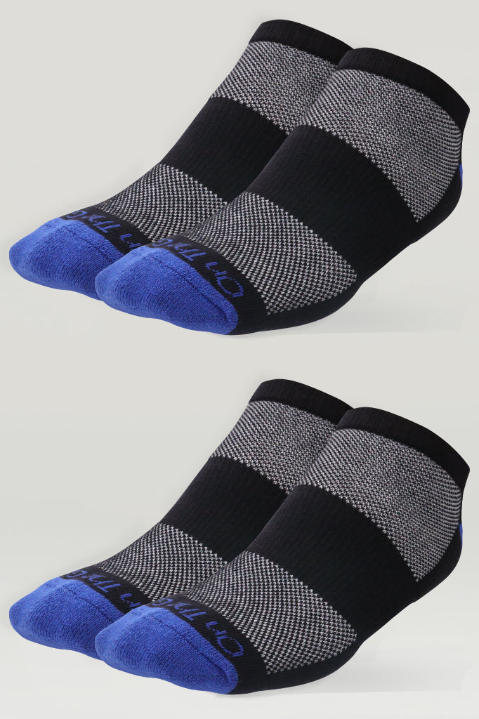 Two pairs of men's ankle socks in black and grey mesh-knit pattern with vibrant navy blue toe, featuring 'On The Go!' branding near the toe area