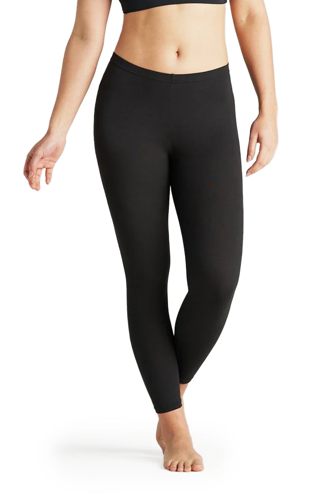 Person wearing black leggings on a white background
